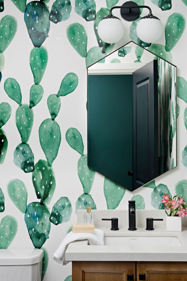 Cactus wallpaper in stylish bathroom with vanity and black mirror